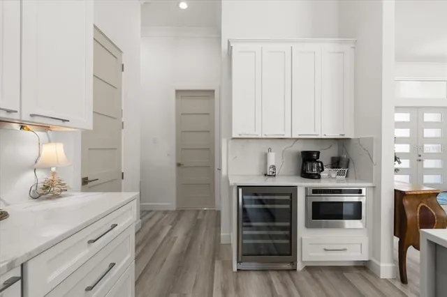 a kitchen with stainless steel appliances a refrigerator and a stove top oven
