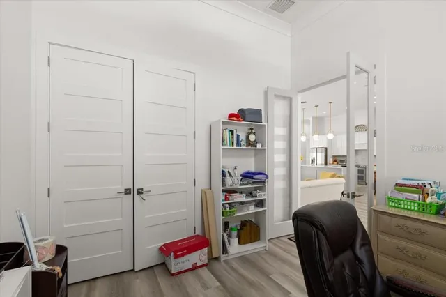 a bedroom with a bed and a chair