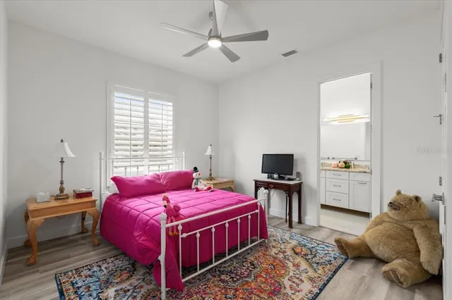 a bathroom with a granite countertop sink a toilet and a bathtub