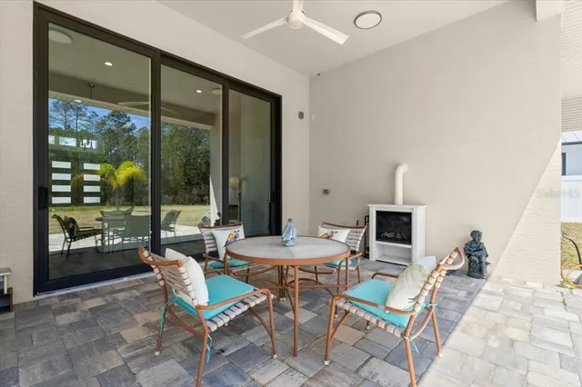 an aerial view of a house with a swimming pool