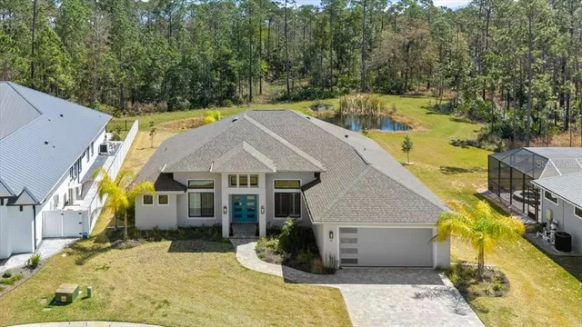 a view of a city with lots of residential buildings ocean and mountain view in back