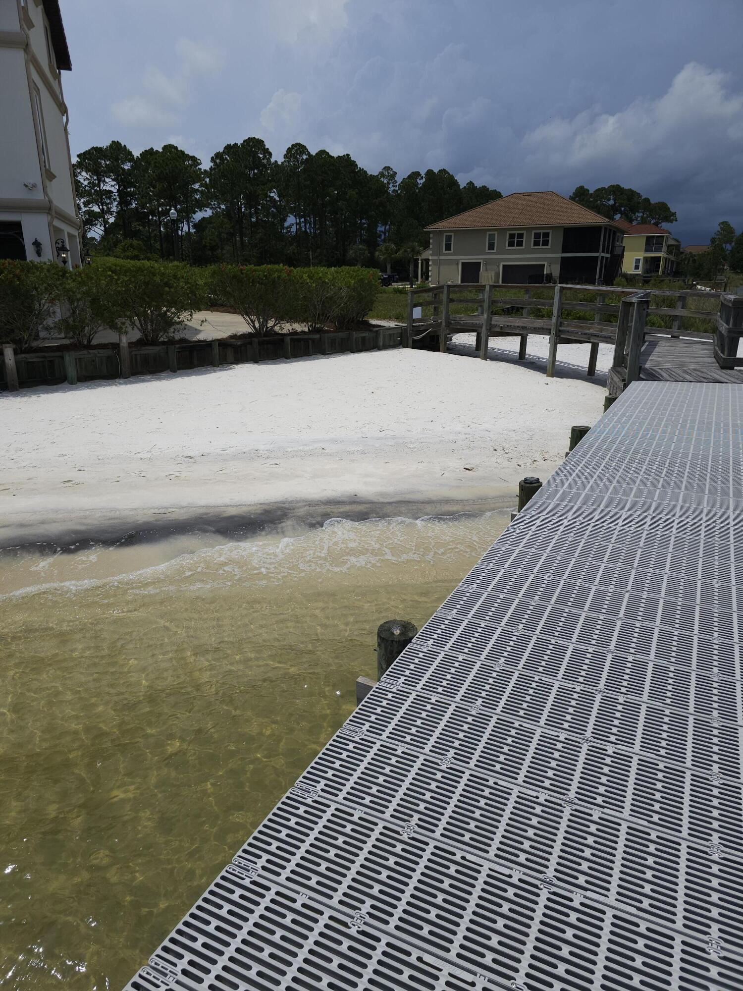 9389 Palmetto Ridge Court Navarre, FL 32566 - Photo 16 of 33 a view of terrace with lake view