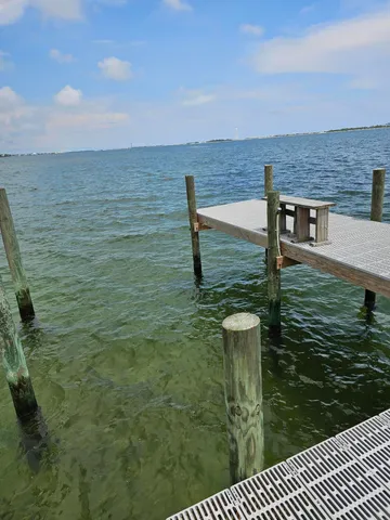 a balcony with table and chairs