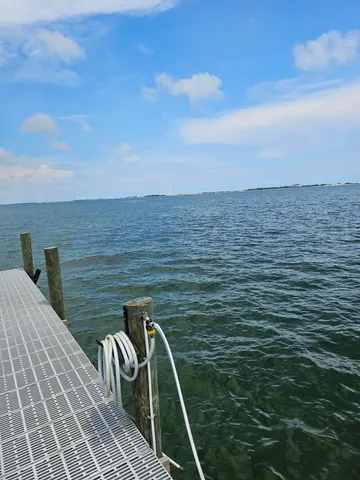 a view of roof deck with two chairs