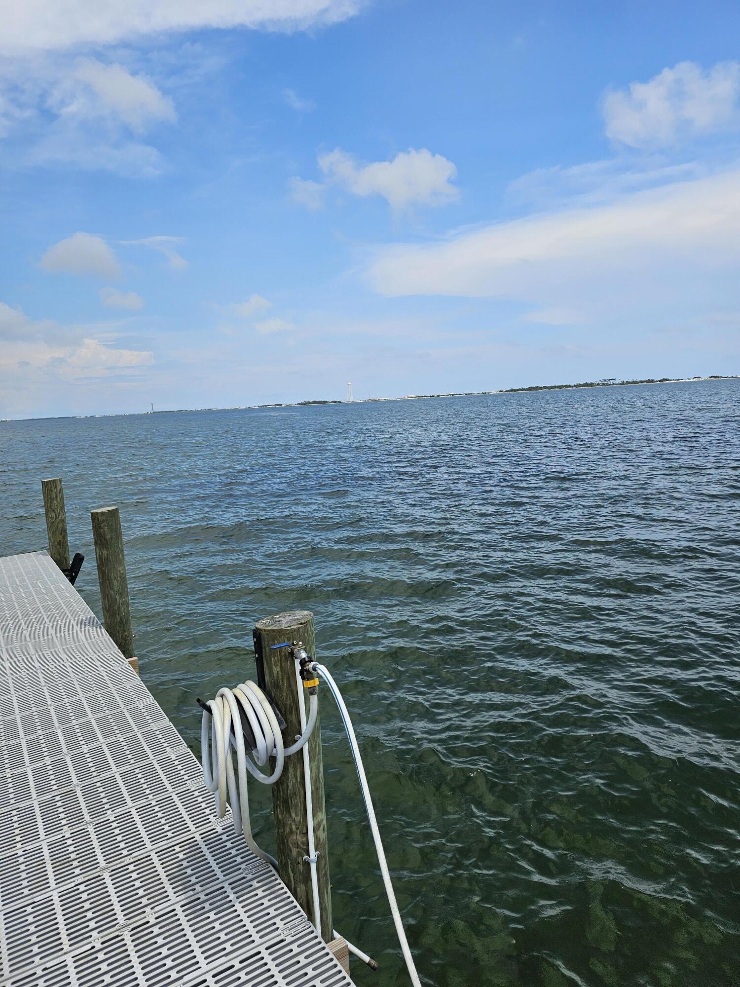 9389 Palmetto Ridge Court Navarre, FL 32566 - Photo 22 of 33 a view of roof deck with two chairs