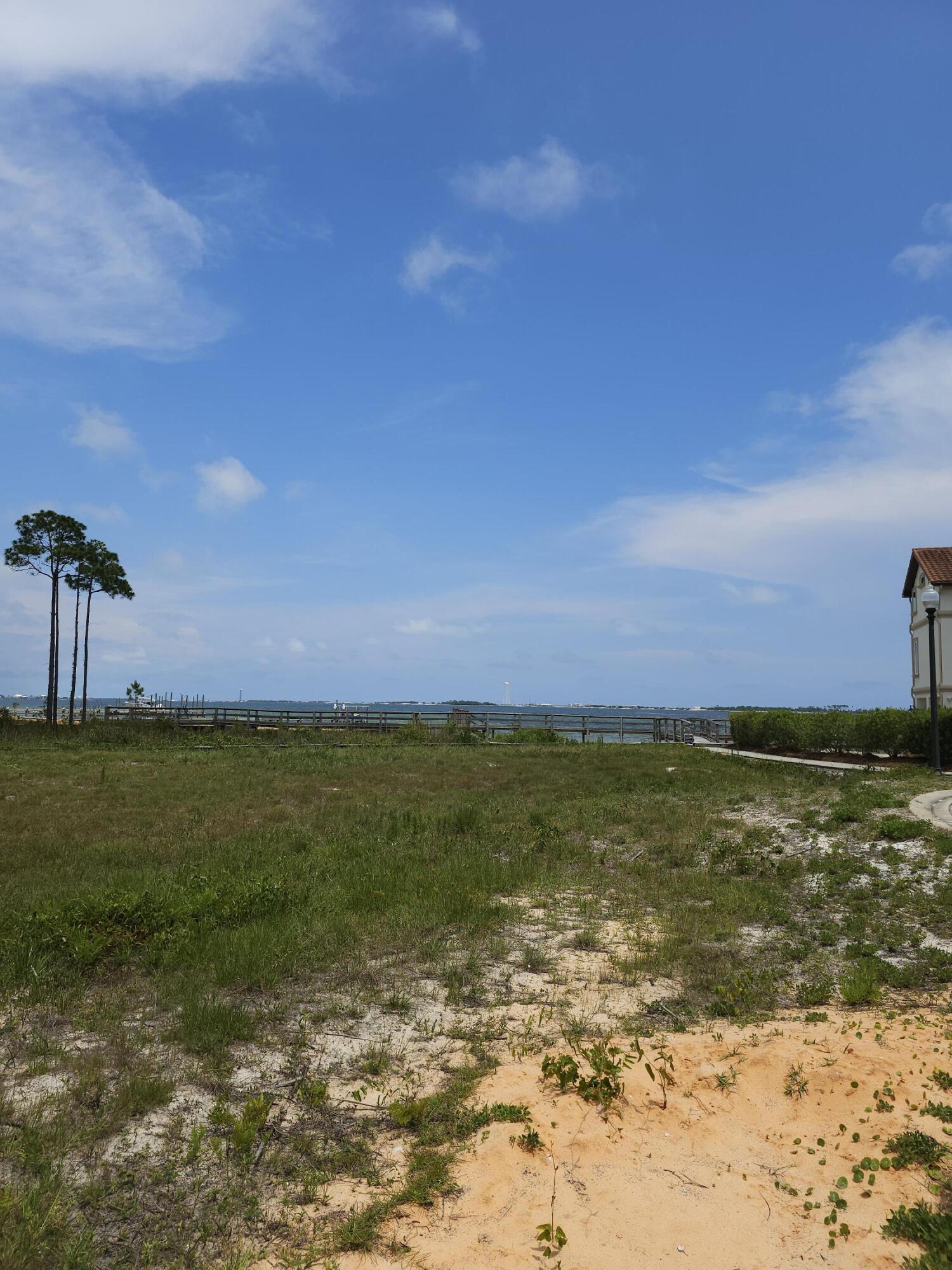 9389 Palmetto Ridge Court Navarre, FL 32566 - Photo 25 of 33 a view of an ocean beach and a mountain
