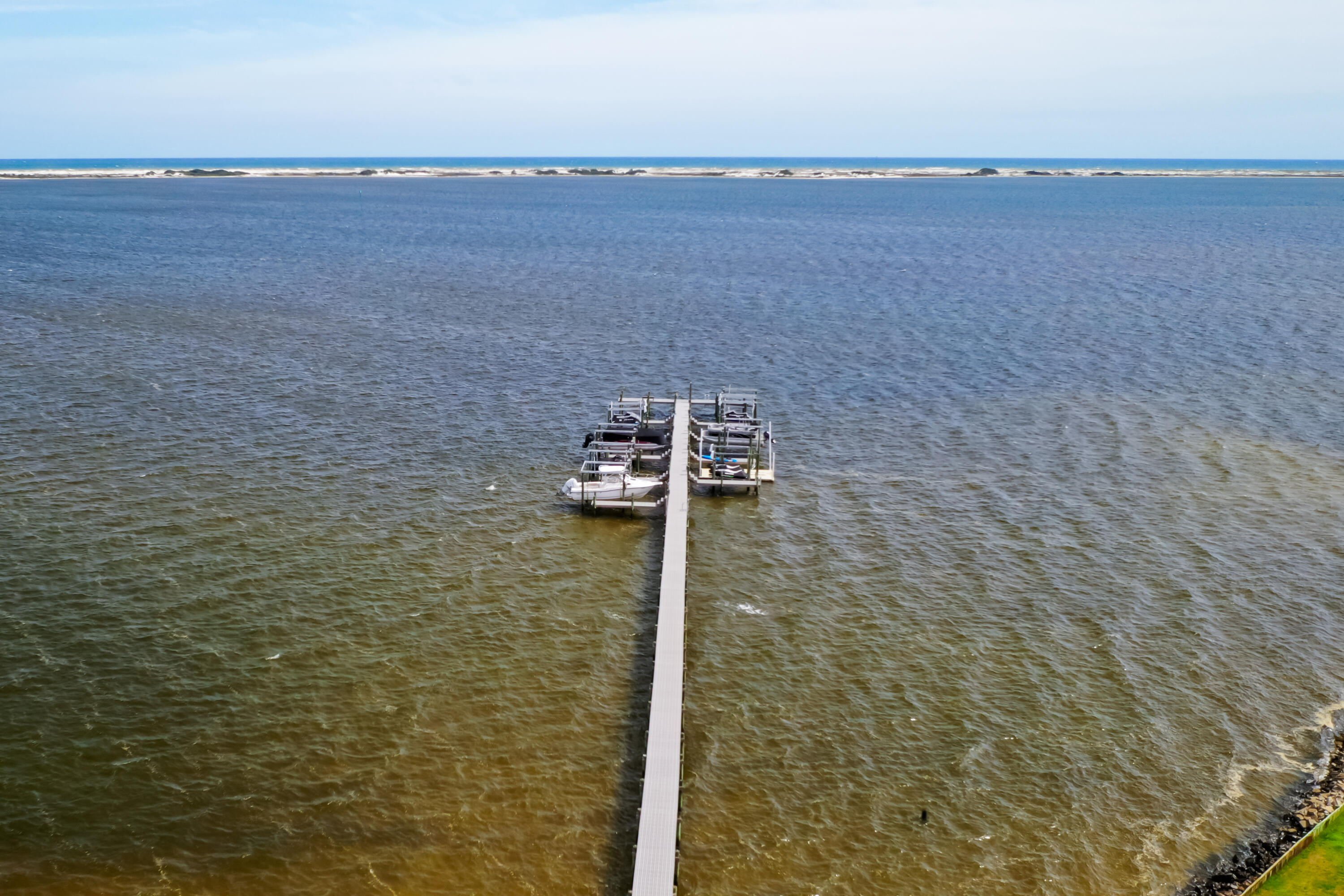 9389 Palmetto Ridge Court Navarre, FL 32566 - Photo 32 of 33 a terrace with a lake view