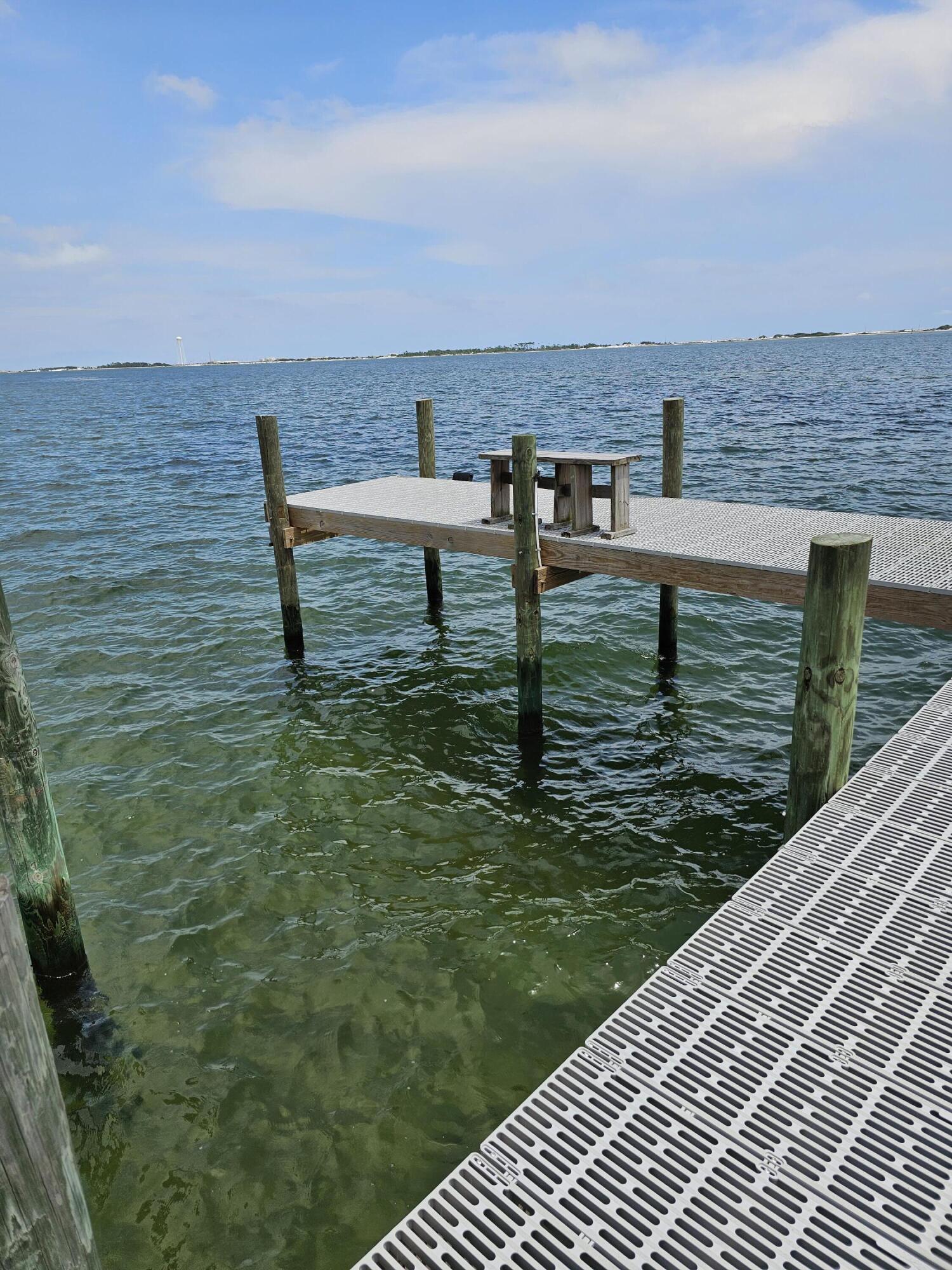 9389 Palmetto Ridge Court Navarre, FL 32566 - Photo 4 of 33 a view of a terrace with two chairs