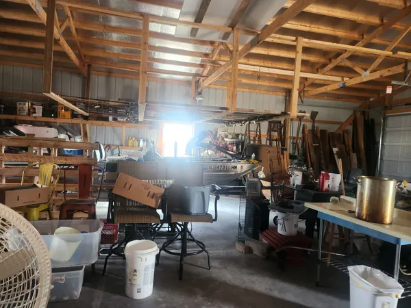 a room with lots of furniture and clutter