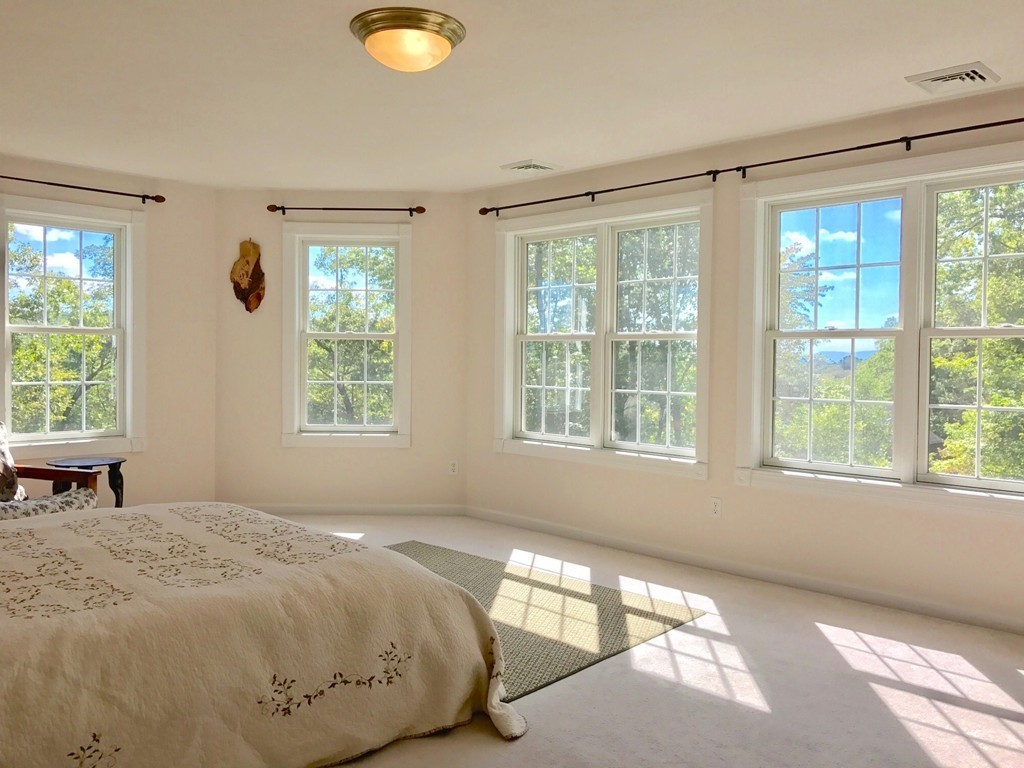 160 East Leverett Road Amherst, MA 01002 - Photo 19 of 30 a spacious bedroom with a bed and a window