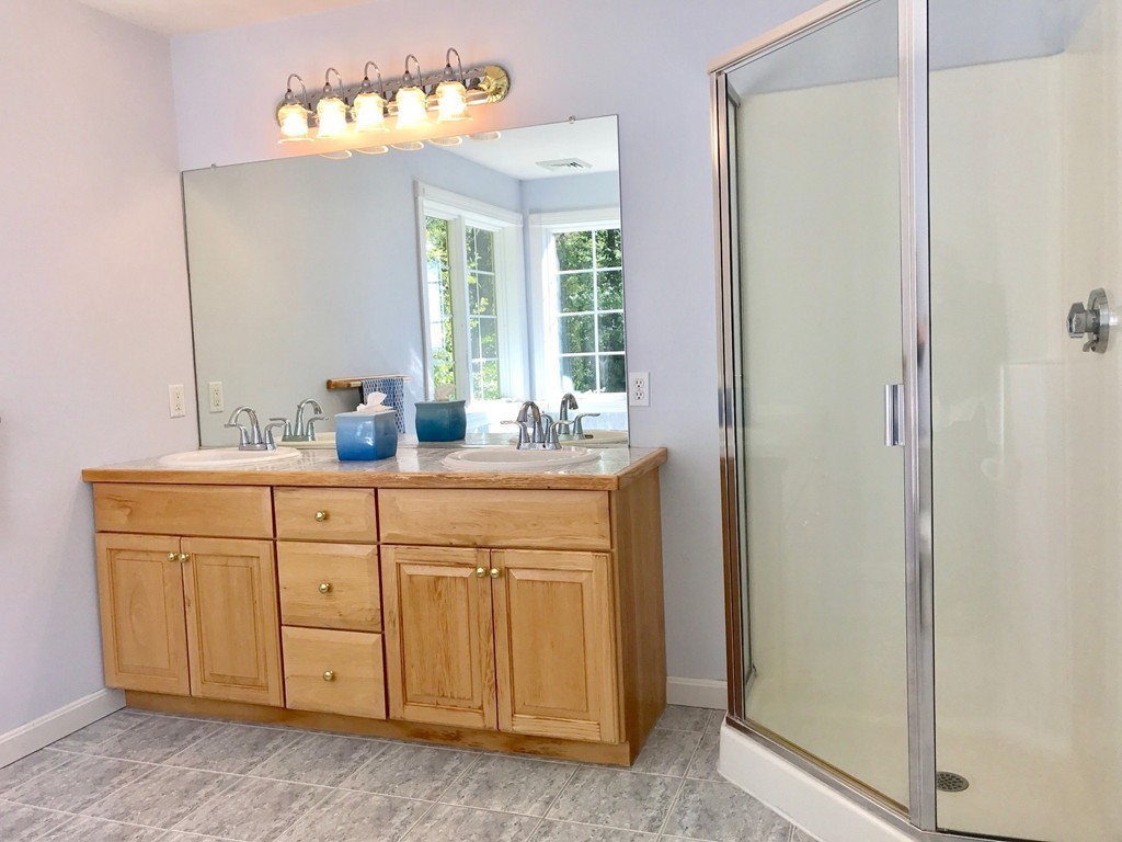 160 East Leverett Road Amherst, MA 01002 - Photo 21 of 30 a bathroom with a sink vanity and mirror
