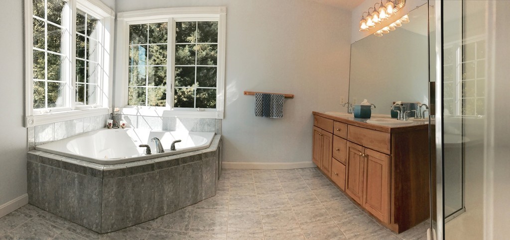 160 East Leverett Road Amherst, MA 01002 - Photo 23 of 30 a bathroom with a tub sink and mirror