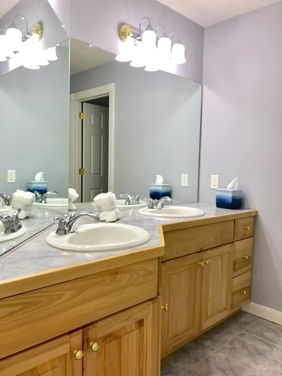 160 East Leverett Road Amherst, MA 01002 - Photo 25 of 30 a bathroom with a sink vanity and a mirror