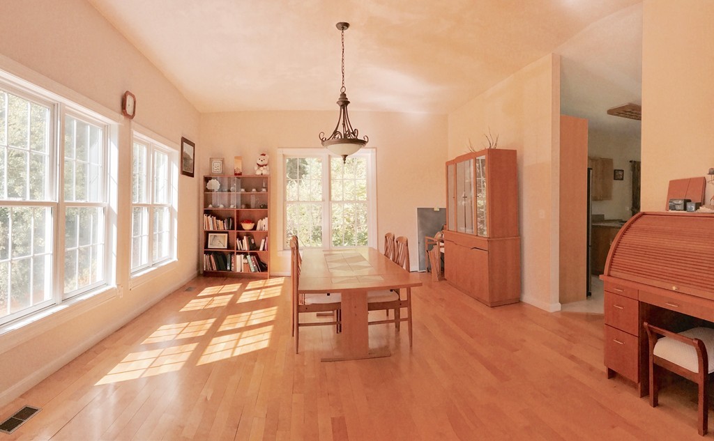 160 East Leverett Road Amherst, MA 01002 - Photo 7 of 30 a dining room with furniture and a floor to ceiling window