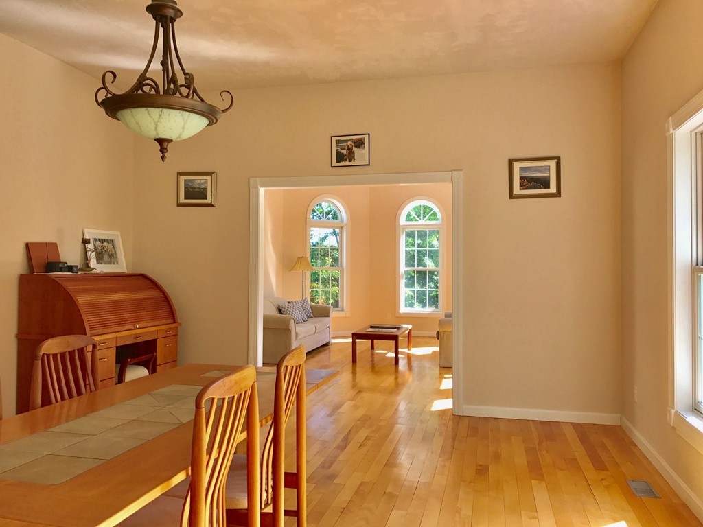 160 East Leverett Road Amherst, MA 01002 - Photo 8 of 30 a view of a dining room with furniture window and wooden floor