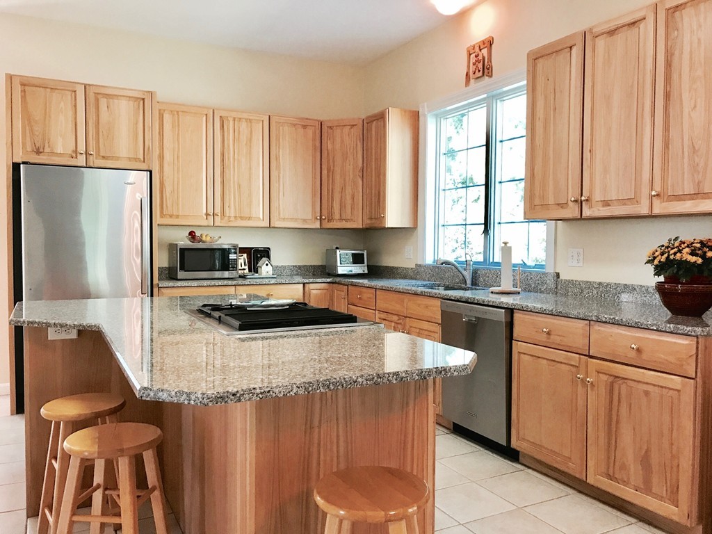 160 East Leverett Road Amherst, MA 01002 - Photo 10 of 30 a kitchen with stainless steel appliances granite countertop a stove a sink dishwasher and a refrigerator