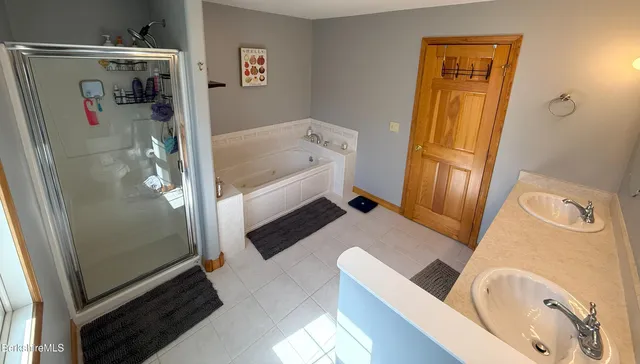 a bath room with a toilet and a tub