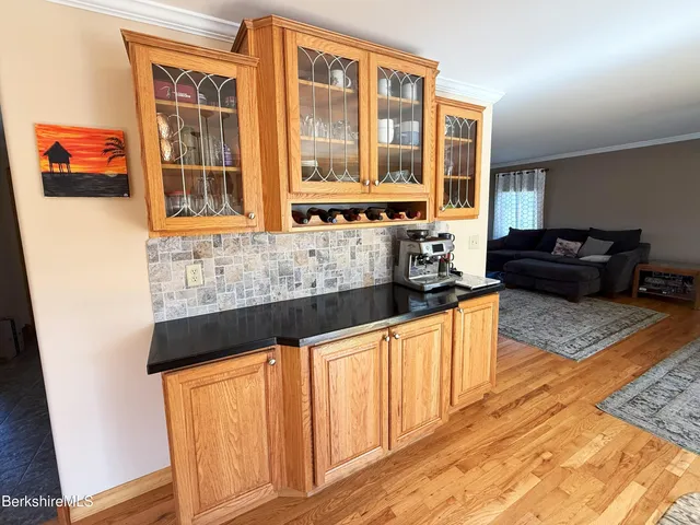 a kitchen with granite countertop a stove and a sink