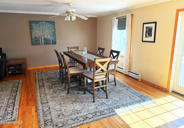 a dining room with a table and chairs
