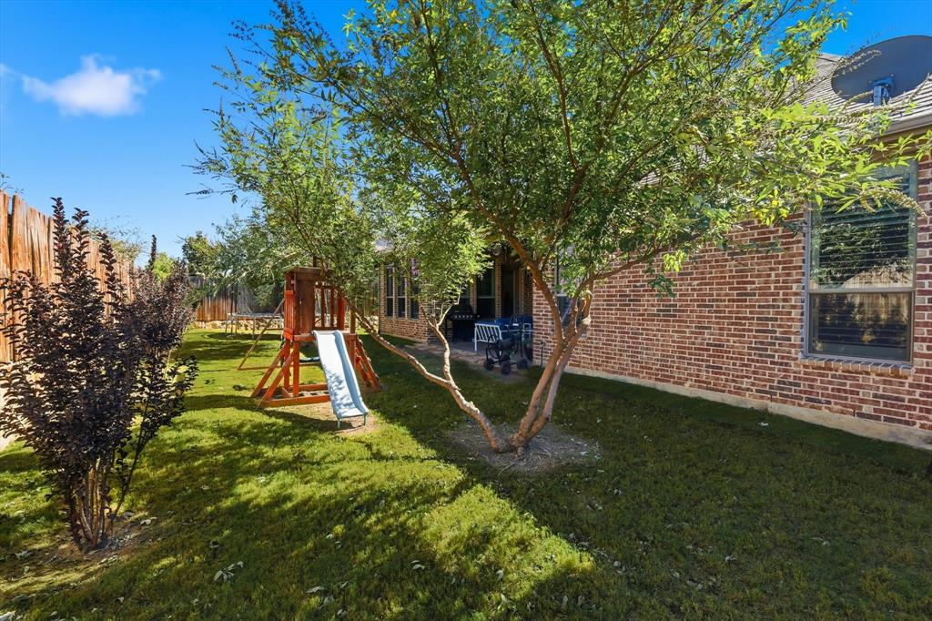 529 Prairie Run Aledo, TX 76008 - Photo 34 of 40 a view of a backyard with a slide