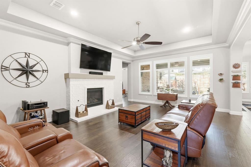 529 Prairie Run Aledo, TX 76008 - Photo 6 of 40 The living area is full of natural light with a cozy gas fireplace
