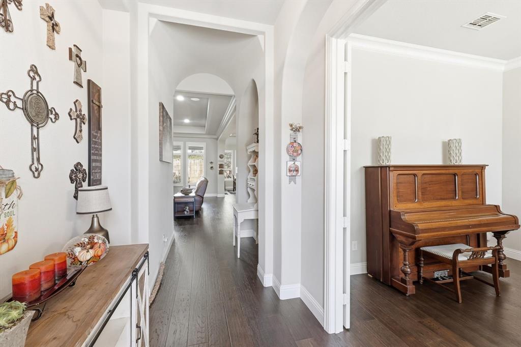 529 Prairie Run Aledo, TX 76008 - Photo 8 of 40 a view of a hallway with wooden floor and furniture