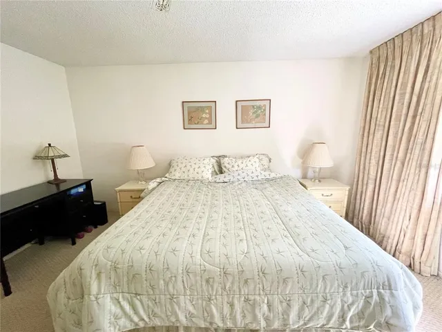 a view of a swimming pool with a yard