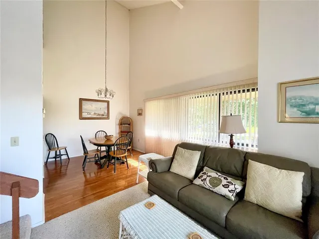 a large white kitchen with a sink and dishwasher with white cabinets