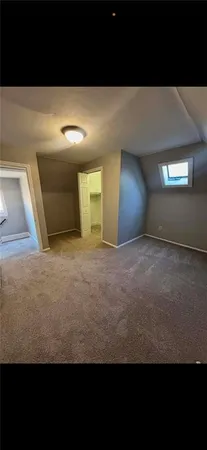a view of front door with wooden floor