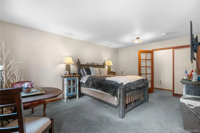 a bedroom with a bed and a table in it