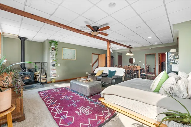 a bedroom with furniture and a rug