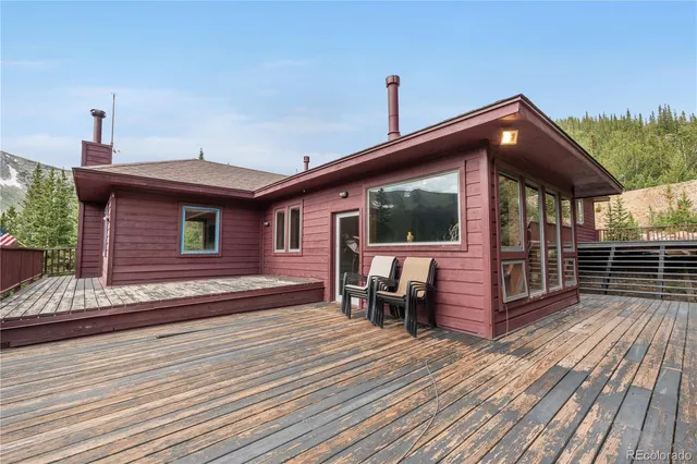a view of a lake with a table and chairs