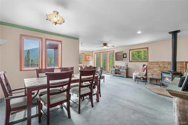 a view of a dining room with furniture and a potted plant