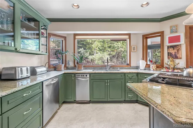 a kitchen with a sink stove and cabinets