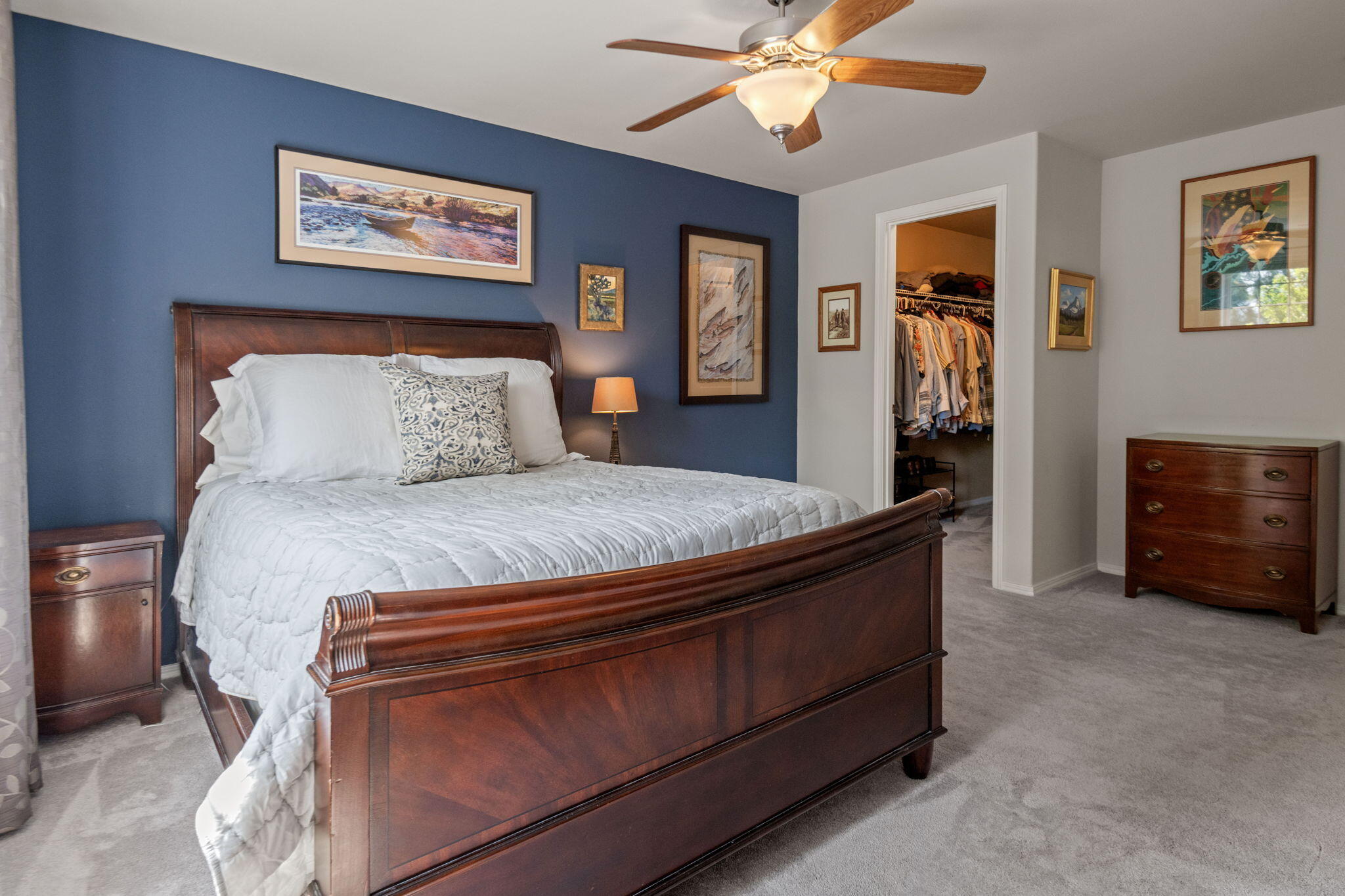 720 North Hindeman Street Sisters, OR 97759 - Photo 11 of 25 a bedroom with a bed and a chandelier