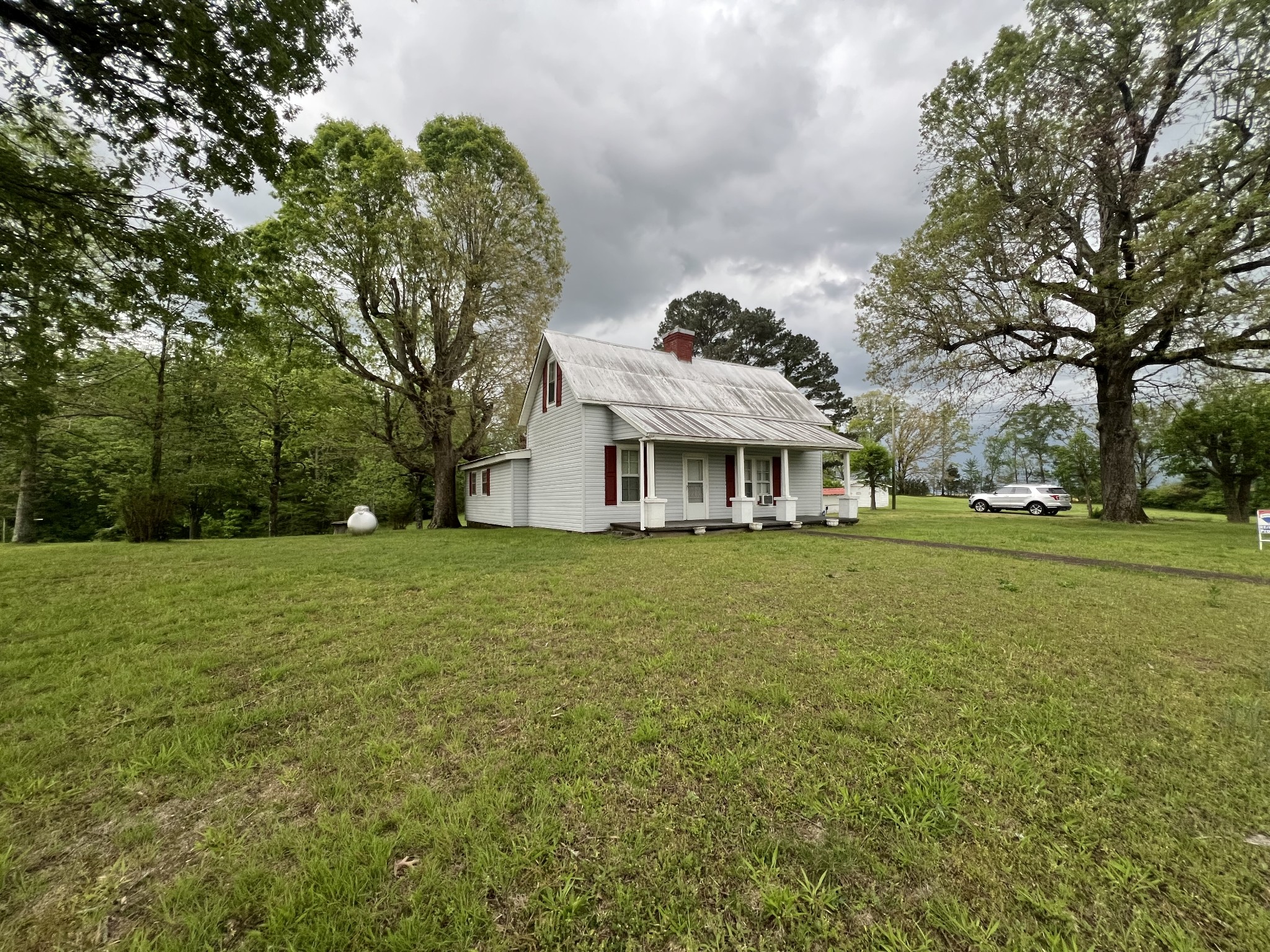 297 Appleton Road Five Points, TN 38457 - Photo 19 of 44 a front view of a house with a garden