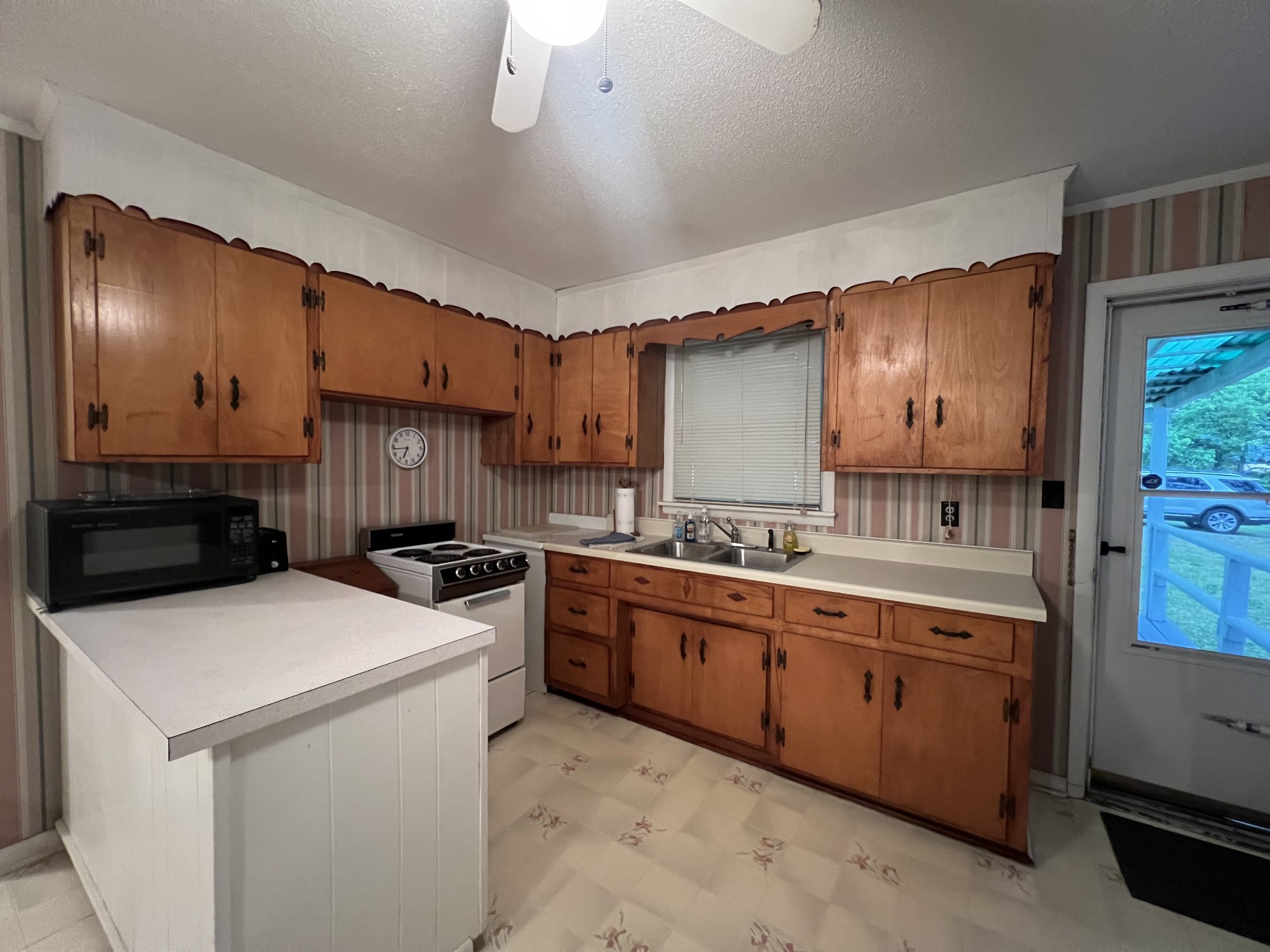 297 Appleton Road Five Points, TN 38457 - Photo 22 of 44 a kitchen with a stove sink and cabinets
