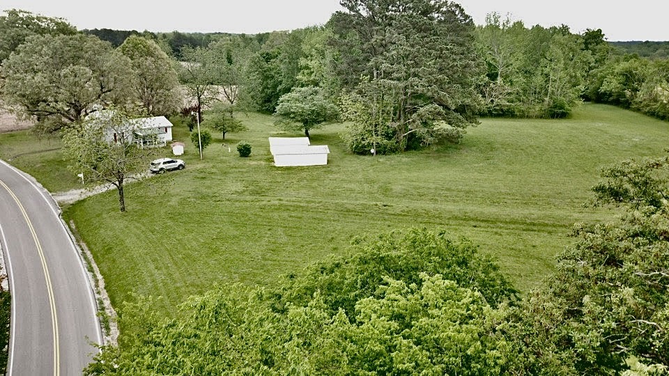 297 Appleton Road Five Points, TN 38457 - Photo 38 of 44 a view of a lake with a building in the background