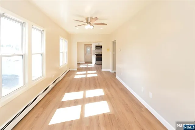 a view of a living room with a large window