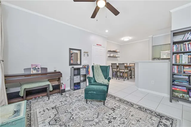 a living room with furniture a piano and bookshelf