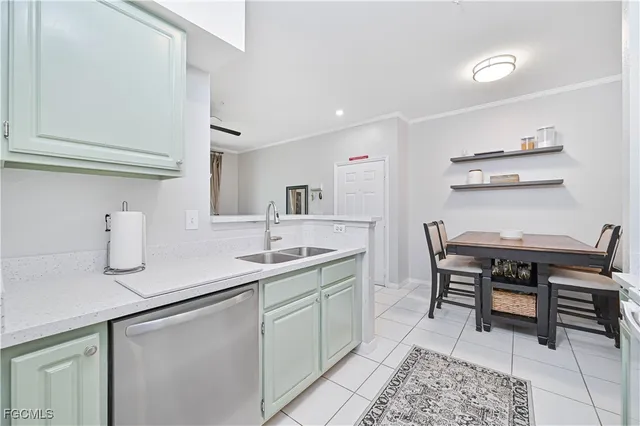 a kitchen with a sink cabinets and wooden floor