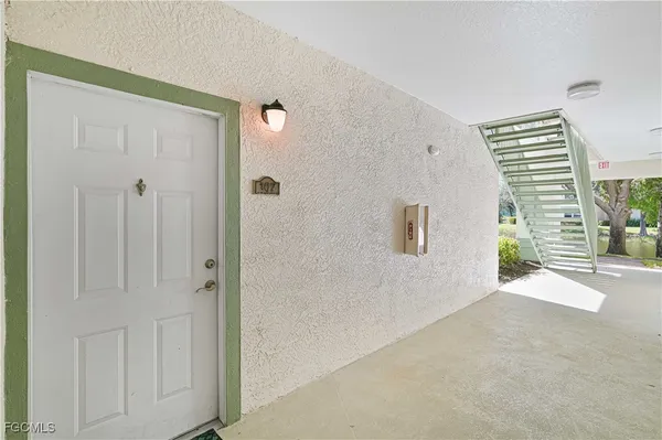 a view of a hallway with windows