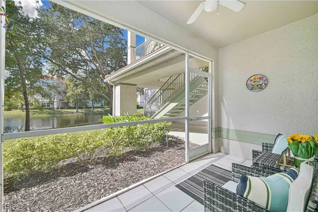 a view of a door and chair in the balcony