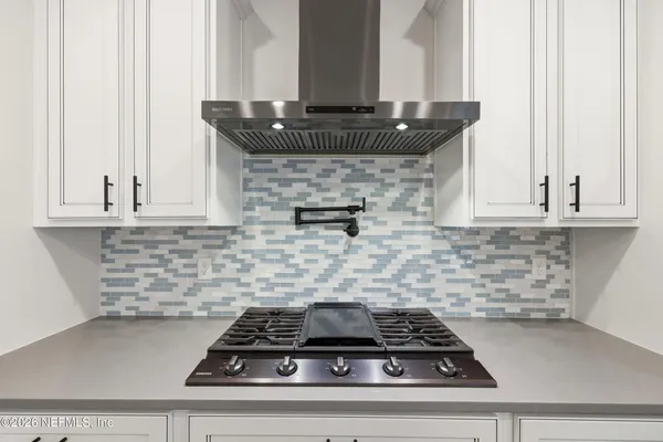 a work room with furniture and a window