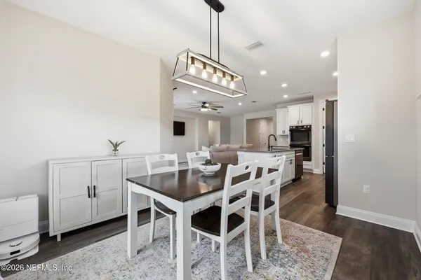 a en suite bathroom with a granite countertop sink a toilet and a shower