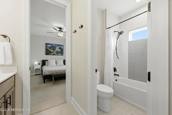 a view of a patio with a table and chairs under an umbrella