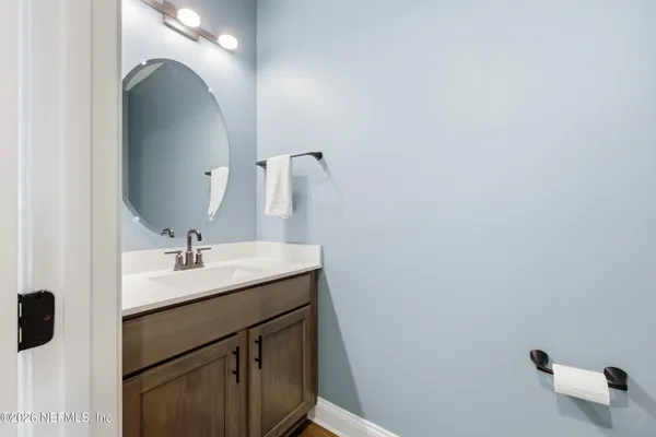 a front view of a house with a big yard