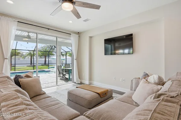 a living room with furniture and a large window