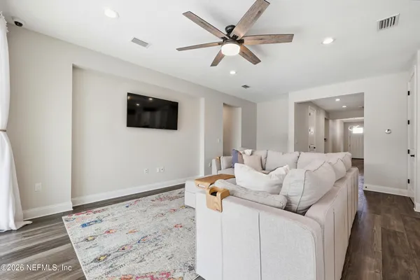 a kitchen with stainless steel appliances granite countertop a sink and a refrigerator