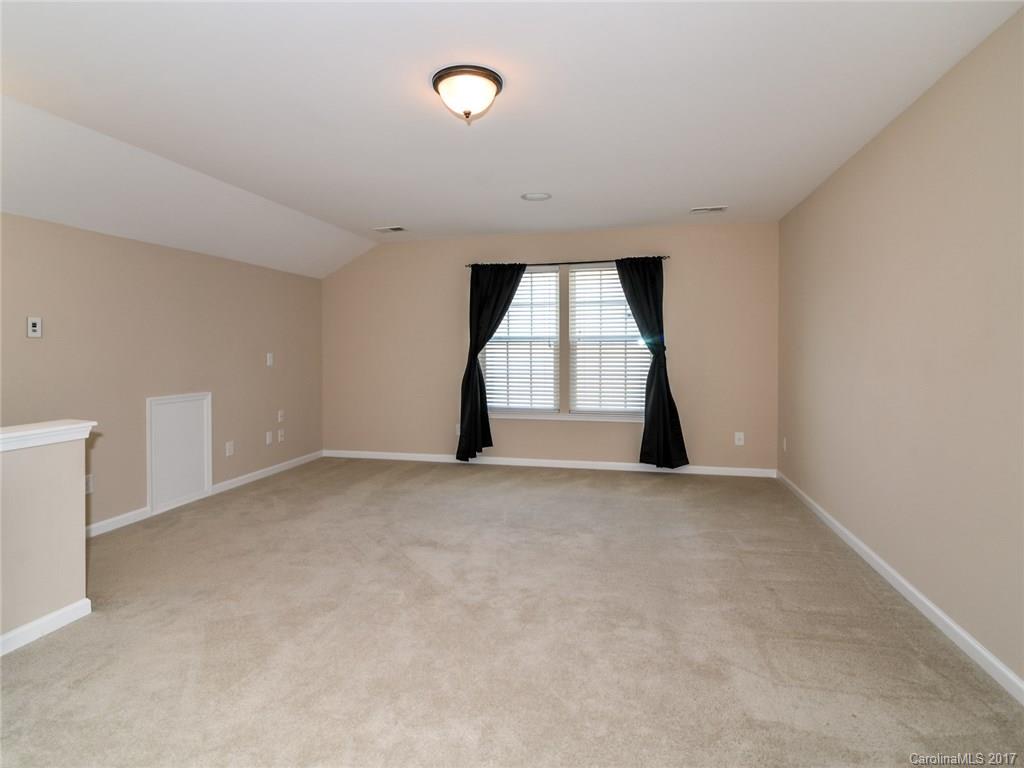 15731 Kiser Corner Lane Davidson, NC 28036 - Photo 16 of 24 an empty room with a empty space and windows